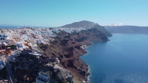 Aerial view flying over city of Oia on Santorini Greece