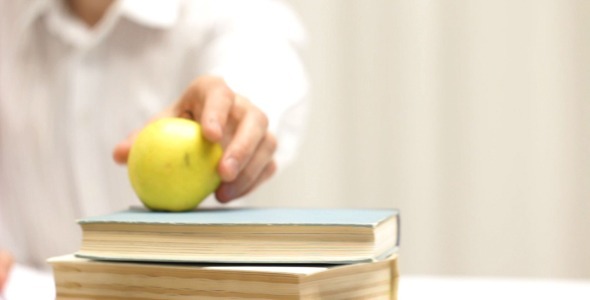 Student and Apple as Symbol of Education