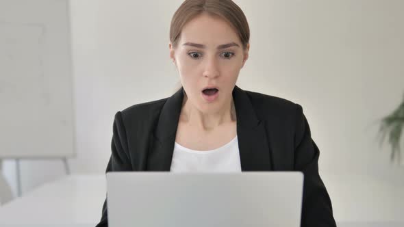 Close Up of Shocked Young Businesswoman Wondering at Work