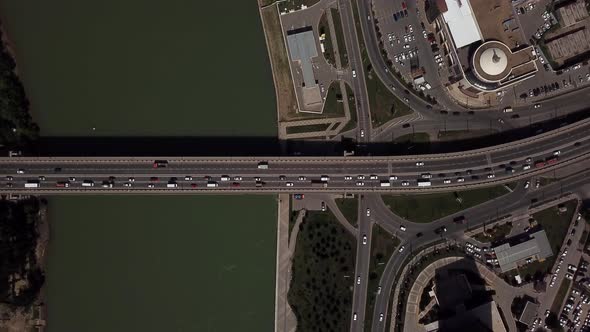 Drone's Eye View -  Aerial Car Driving on a Car Bridge.