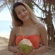 Positive Ethnic Woman Drinking Coconut Cocktail - VideoHive Item for Sale