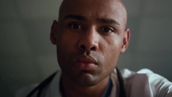 Portrait African American Therapist Checking Light Reaction in Clinic Ward