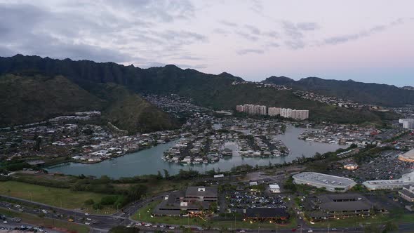 Wide aerial panning shot of Hawaiian suburbs in low light on the island of O'ahu, Hawaii. 4K