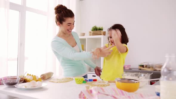 Mother and Daughter Having Fun at Home Kitchen