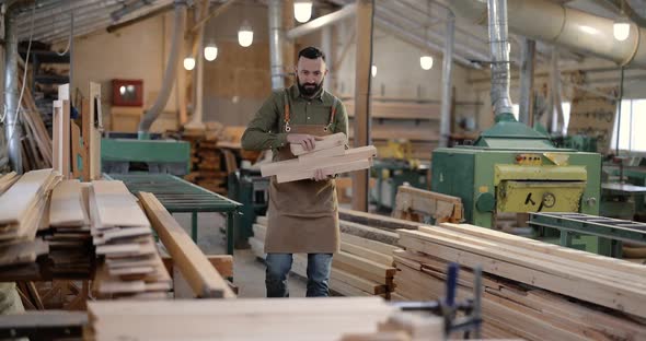 Man Working with Wood at the Joinery