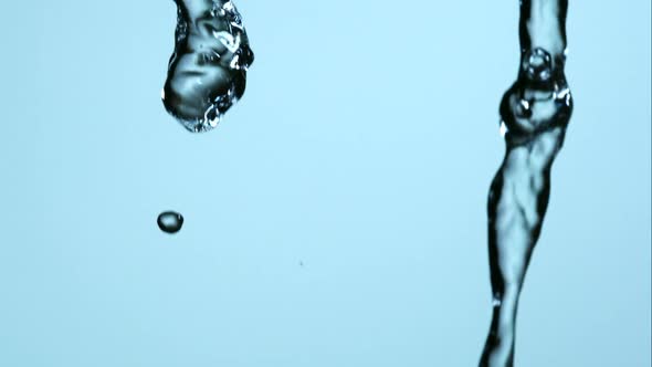 Water pouring and splashing in ultra slow motion 1500fps on a reflective surface - WATER POURS