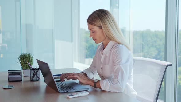 Concentrated Woman Sets a Comfortable Temperature Hot Summer Time