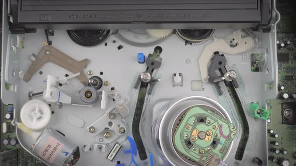 Closeup Shot Showing Inside of a Vcr While It Ejects a Vhs Cassette