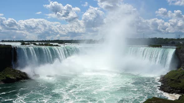 Niagara Falls with High Mist in the Middle on a Sunny Day with Clouds, Tripod Wide Shot, Slow Motion