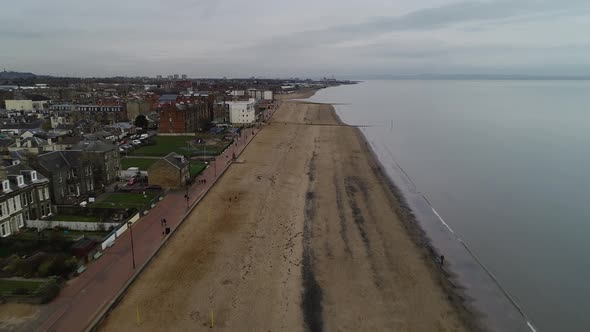 Flying over Portobello Beach, Edinburgh. Tracking shot.