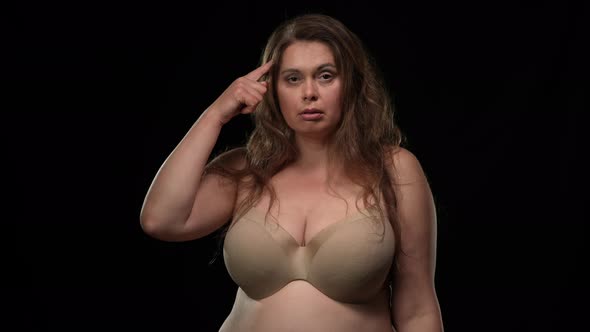 Self Assured Plus Size Caucasian Woman Looking at Camera Gesturing Think Gesture