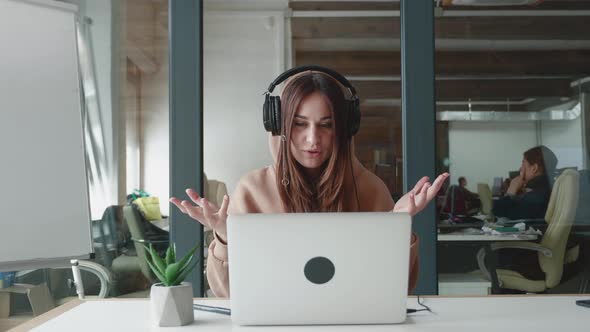 Attractive Wearing Headphones Communicating By Video Call