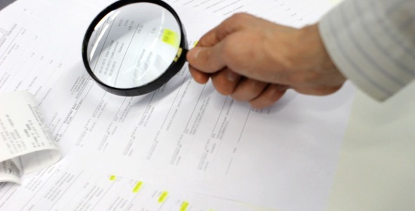 Bookkeeping With Magnifying Glass
