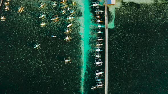 Pier with Boats in the Sea Aerial View