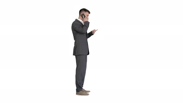 Business Man in a Suit Talking with Mobile Phone on White Background