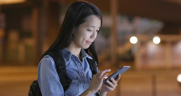 Woman use of mobile phone in street