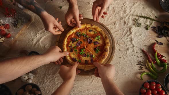 Friends Group Sharing Pizza Slice on Cutting Board Table at Restaurant Pizzeria