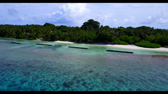 Aerial drone shot nature of paradise coast beach vacation by blue lagoon with white sandy background