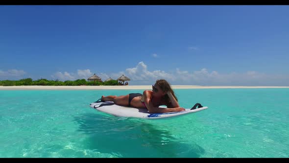 Girls tan on relaxing sea view beach wildlife by blue ocean with white sand background of the Maldiv