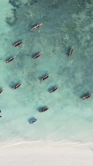 Boat Boats in the Ocean Near the Coast of Zanzibar Tanzania Slow Motion Vertical Video