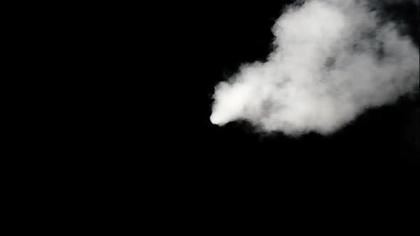 Smoke emitting from the middle of the screen as the wind blows it around. Shot on black for easy com