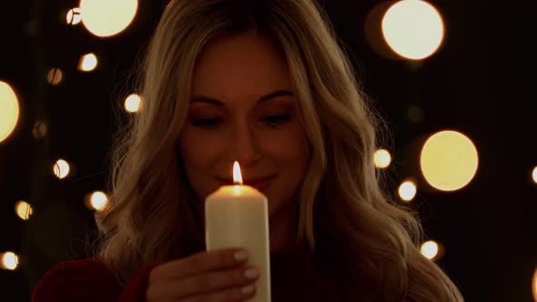 Attractive Woman Holding A Candle