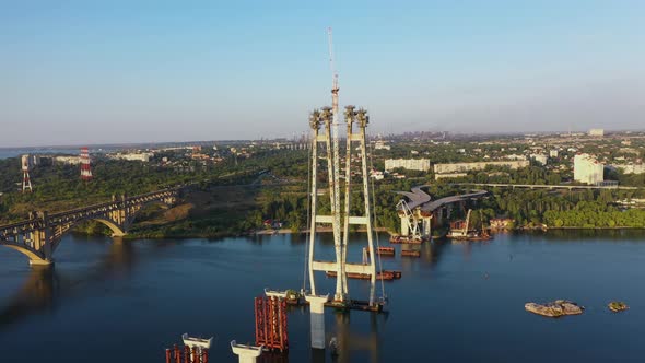 Incomplete Automobile Bridge on the Background of an Industrial City