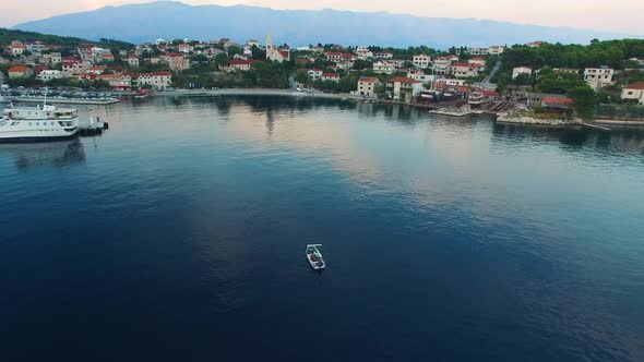 Aerial view of a boat anchored in the bay of Selca Island Brac Croatia Europe