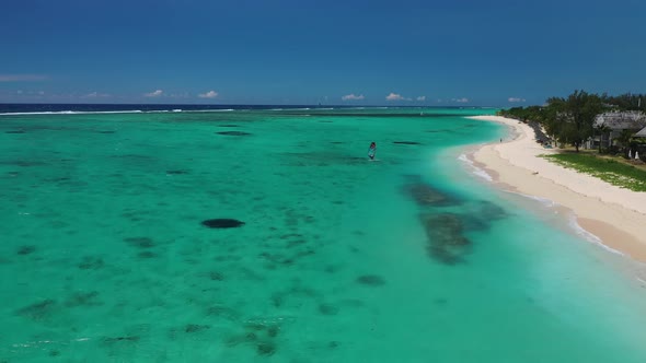 Beach with luxury hotel, white sand and palm trees, Mauritius, Africa