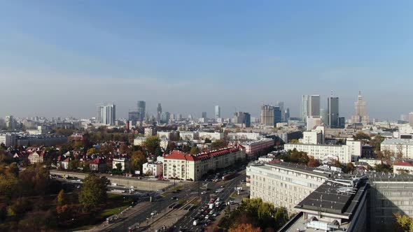 Hyperlapse of rapid traffic flowing through smogged Warsaw's city centre, air pollution and modern s