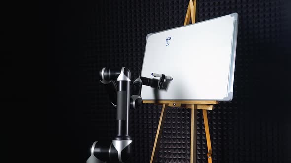 Programmed Robot Draws a Picture, a Futuristic Robot Hand Draws a Marker on a Blackboard, Robot