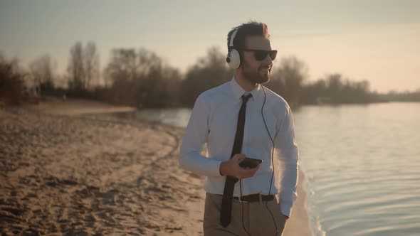 Man Listening To Music In Headphone. Businessman Relaxing Enjoying After Good News Having Fun.