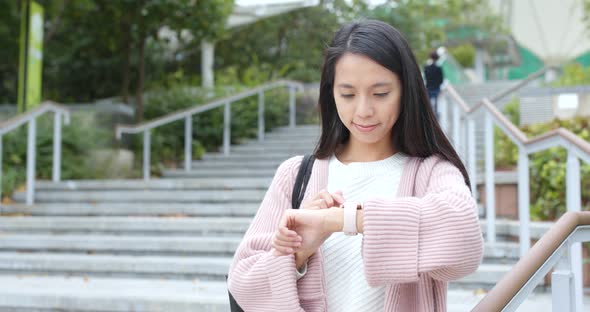 Woman using smart watch at outdoor