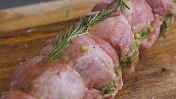 Chef Sprinkle Spices Over a Piece of Meat with Rosemary, Prepares the Food.