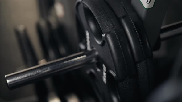 Closeup Macro Close Up of Handsome Bodybuilder Guy Prepare to Do Exercises with Barbell in a Gym