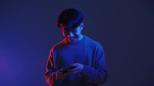 Mobile Gaming Neon Light People Asian Guy Playing