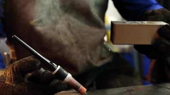 Male welder working on a piece of metal