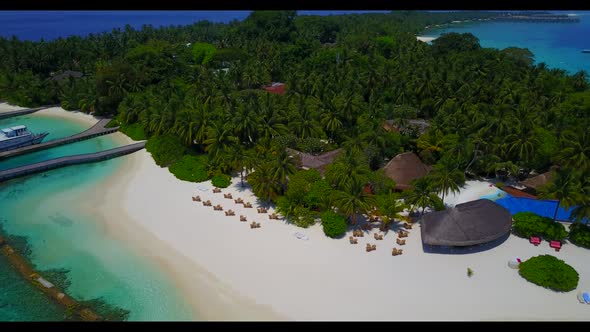 Aerial panorama of tranquil lagoon beach lifestyle by blue sea with white sandy background of a dayo