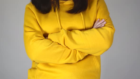 Front View on Body Part of Young Female on Gray Background