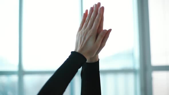 Closeup of Goodlooking Young Woman Is Putting Hands in Namaste Poture