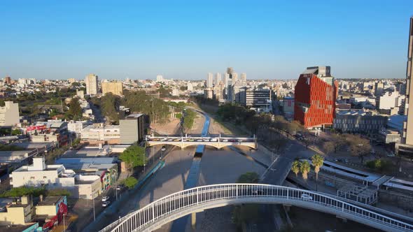 Aerial establishing shot, drone flyover Puente Ramón Bautista Mestre and Puente Centenario along Suq