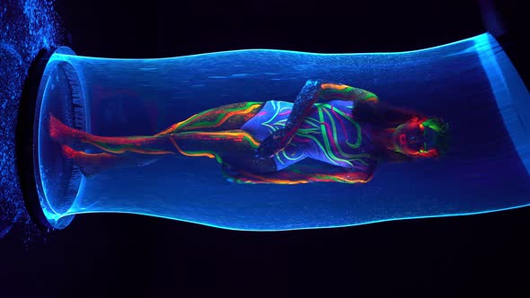 Female Model with Colorful Body in Bubble Tube