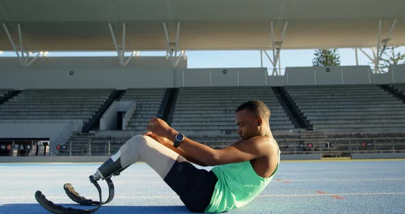 Disabled athletic exercising on a running track 4k