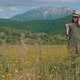 Woman Picks Wildflowers In Meadow - VideoHive Item for Sale