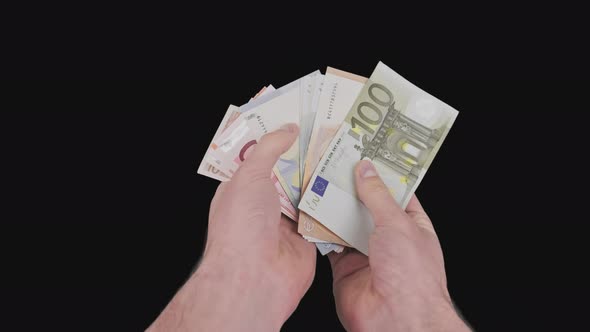 Male Hands Count a Lot of Euro Bills of Various Denominations with Alpha Channel