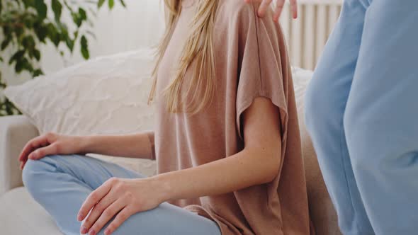 Moving Footage Young Caucasian Mother Sitting in Lotus Position on Sofa Meditating Enjoying