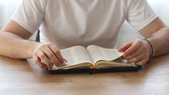 Sunday readings bible, a christian man reading the bible.