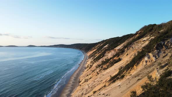 Drone view of the constantly re-sculpt cliff lines of coloured sands at Rainbow Beach Queensland Aus