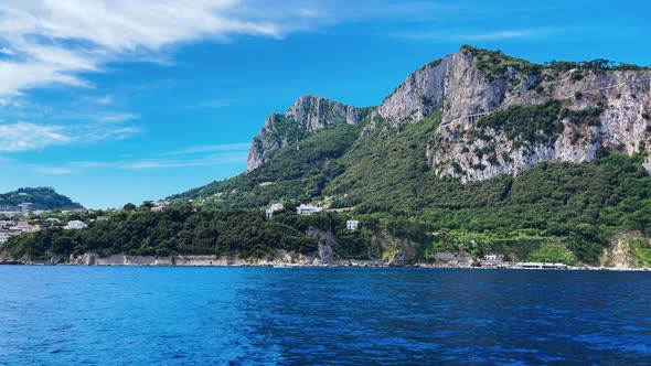 Capri Coastline in Summer Seaon Panoramic View From a Moving Boat in the Sea Italy