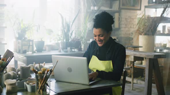 Woman Potter Has Video Call On Laptop